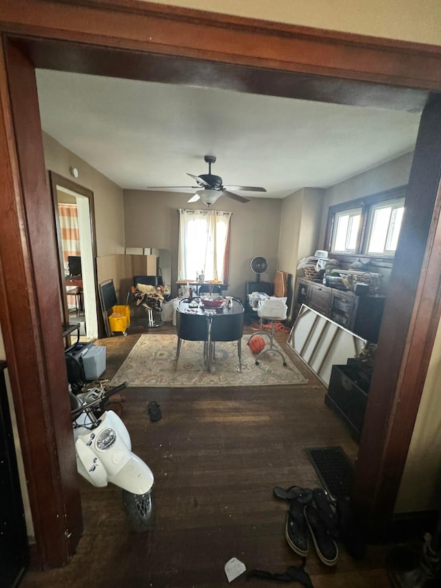 living room featuring ceiling fan, plenty of natural light, and wood-type flooring