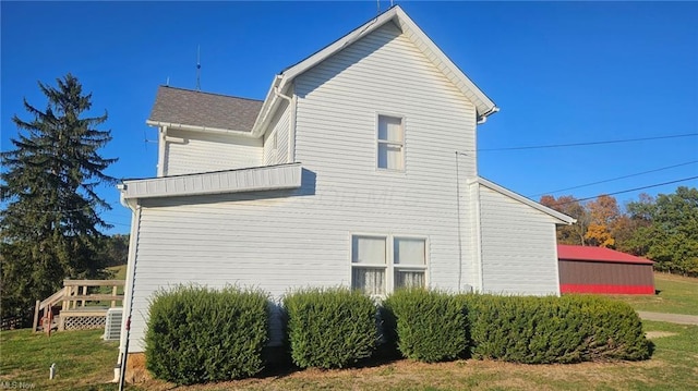 view of home's exterior featuring a lawn