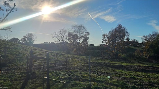 view of yard with a rural view