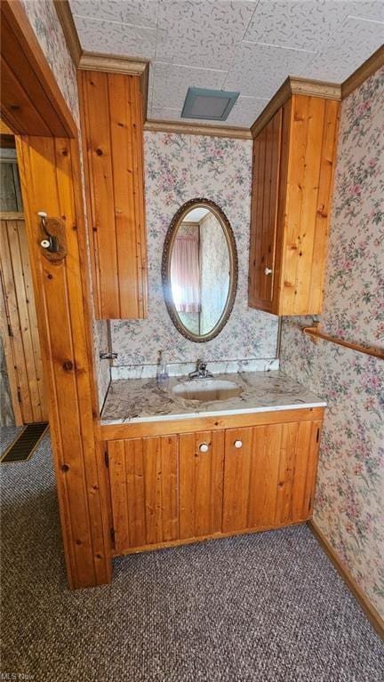 bathroom featuring vanity and ornamental molding