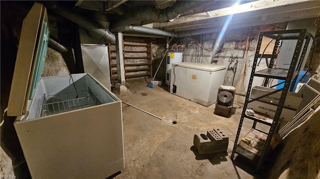 basement featuring fridge and water heater