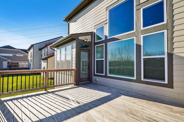 wooden deck with a lawn