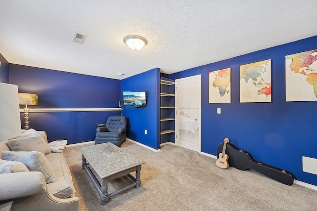 interior space with a textured ceiling and carpet