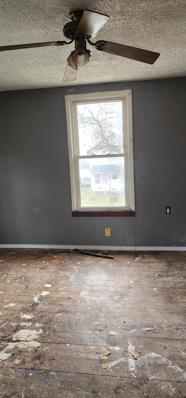 unfurnished room featuring a textured ceiling