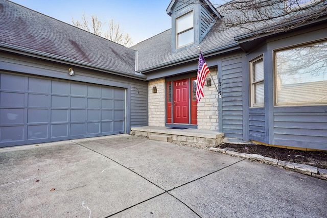 view of exterior entry featuring a garage