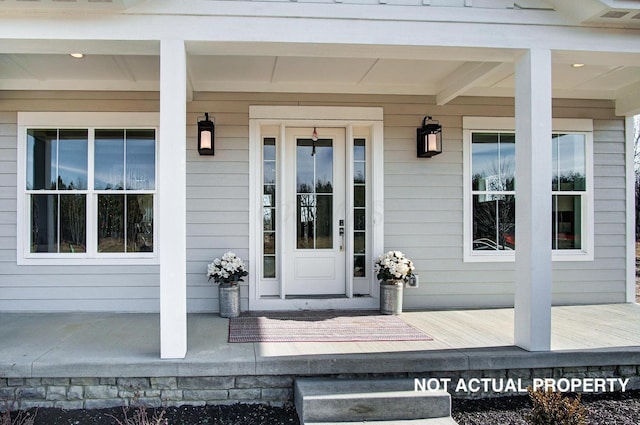 entrance to property with covered porch