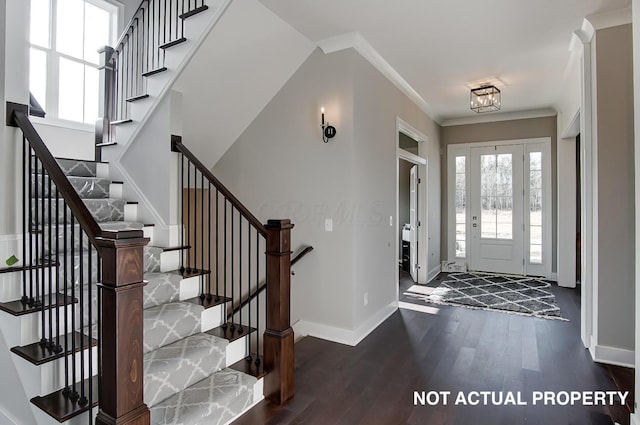 entryway featuring dark hardwood / wood-style floors and crown molding