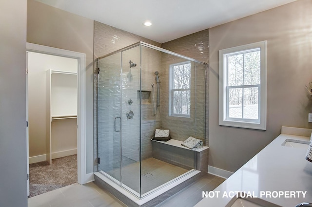 bathroom featuring vanity and walk in shower