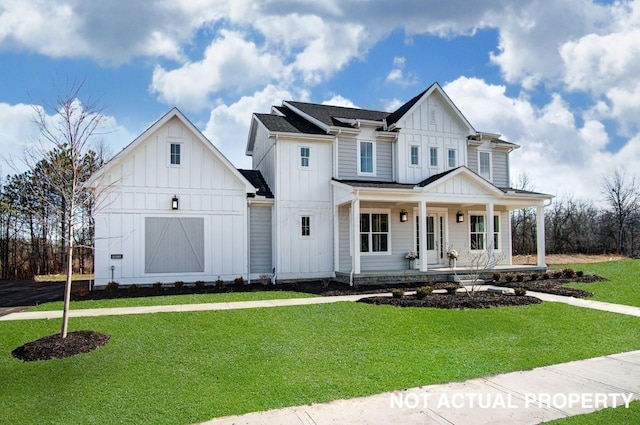 view of front of home with a porch and a front yard