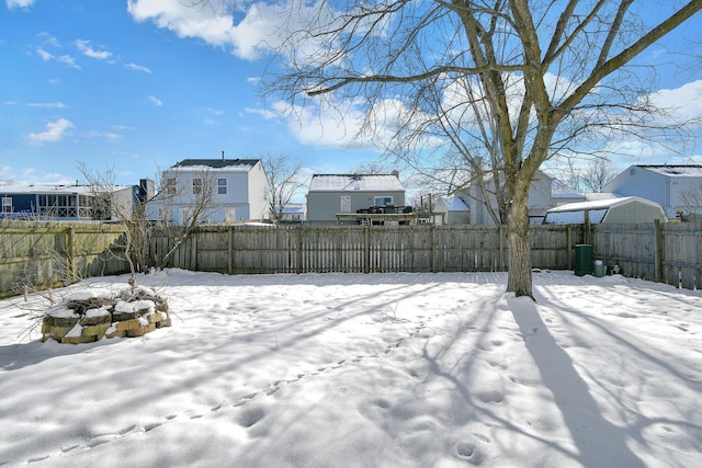 view of yard layered in snow