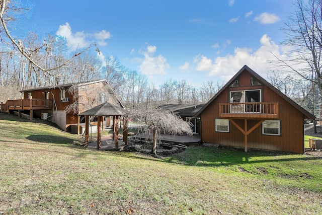 rear view of house featuring a gazebo, central AC, and a yard