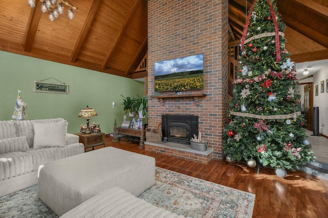 living room with high vaulted ceiling, wood-type flooring, a brick fireplace, beam ceiling, and wood ceiling