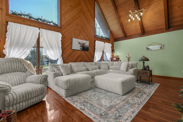 living room featuring beam ceiling, a wealth of natural light, wood ceiling, and a notable chandelier