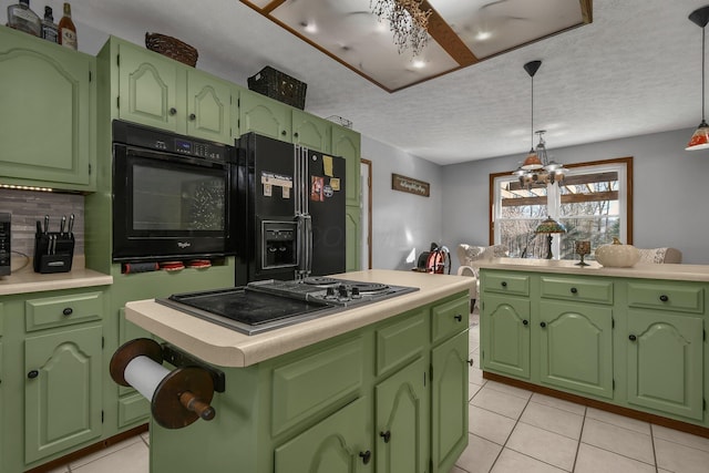 kitchen with a center island, an inviting chandelier, black appliances, a textured ceiling, and decorative light fixtures