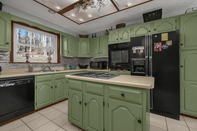 kitchen featuring green cabinets, sink, light tile patterned floors, and black appliances