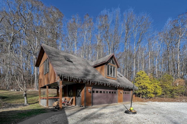 view of front of house with a hot tub and a garage