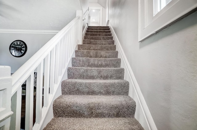 stairs featuring ornamental molding