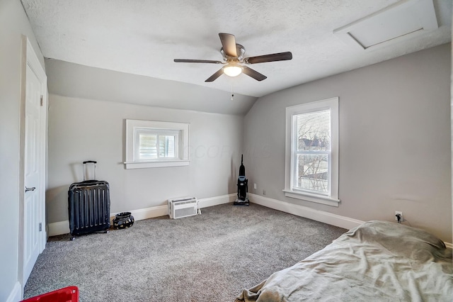 bedroom with multiple windows, carpet flooring, vaulted ceiling, and ceiling fan