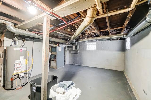 basement featuring heating unit and gas water heater