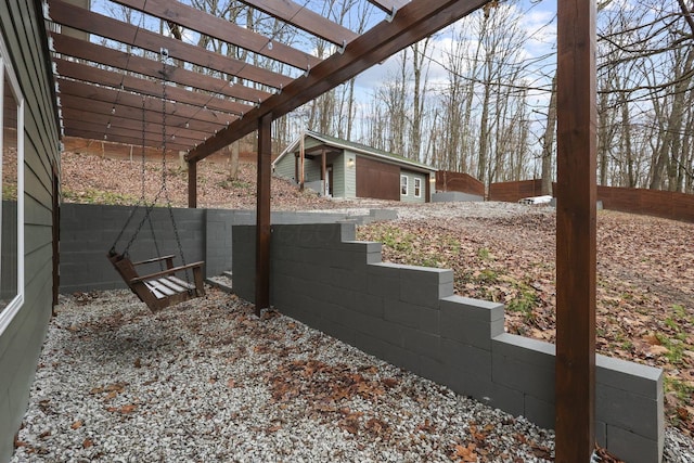 view of yard featuring a pergola and an outdoor structure