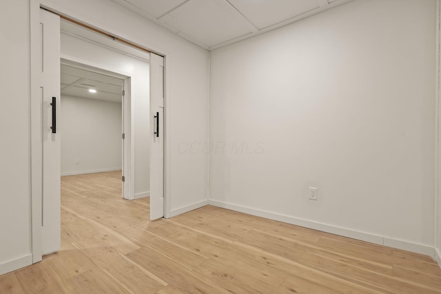 spare room featuring wood-type flooring