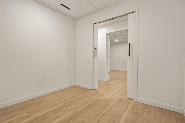 unfurnished room with light hardwood / wood-style floors