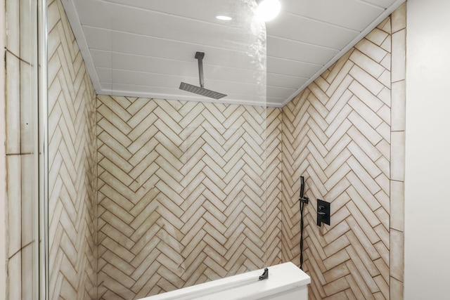 bathroom with a tile shower