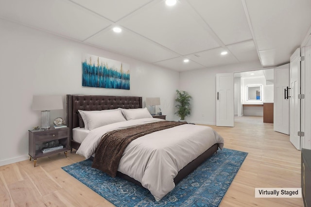 bedroom with light hardwood / wood-style floors