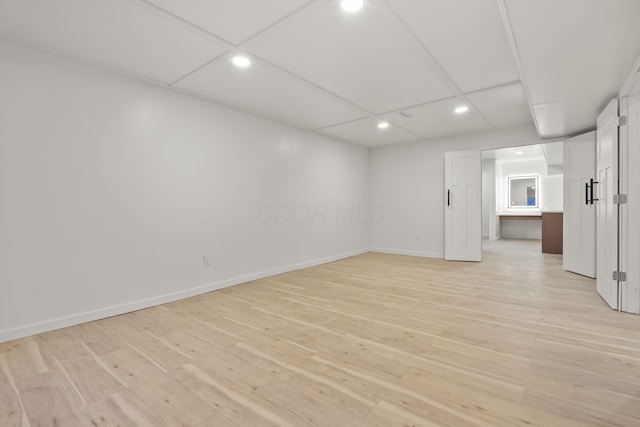 unfurnished room with light wood-type flooring