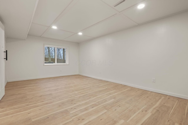 spare room featuring light hardwood / wood-style floors