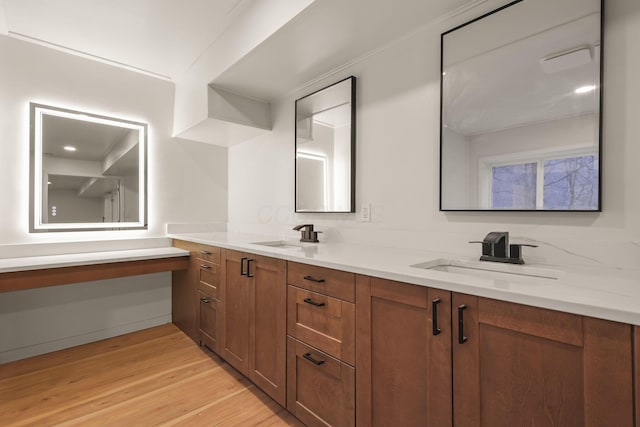 bathroom featuring hardwood / wood-style flooring and vanity