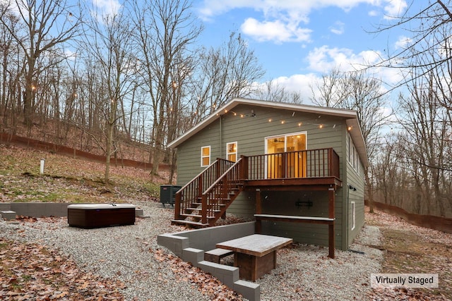 back of house featuring central air condition unit