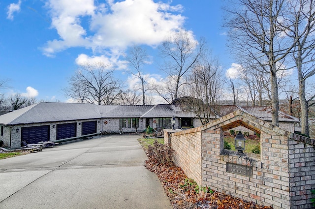 single story home with a garage