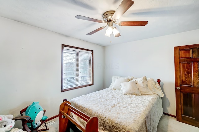 bedroom featuring ceiling fan and light carpet