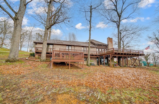 rear view of property with a wooden deck