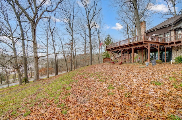 view of yard with a wooden deck