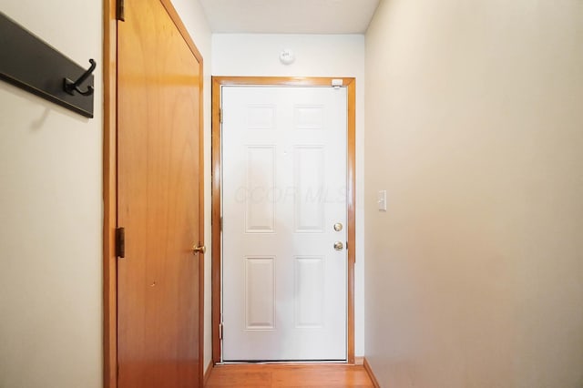 hallway with light hardwood / wood-style flooring