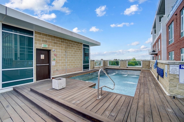 view of pool featuring a wooden deck