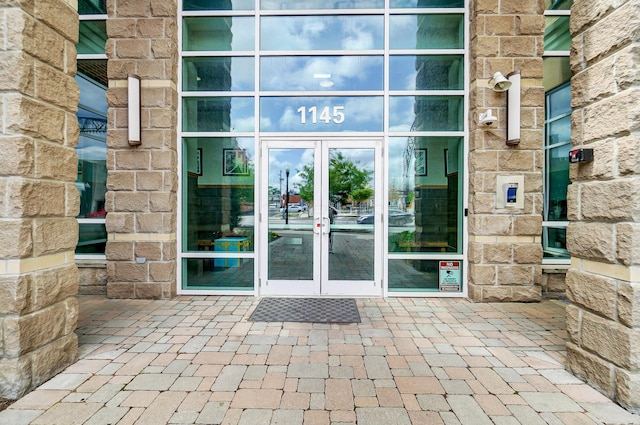 view of exterior entry featuring french doors