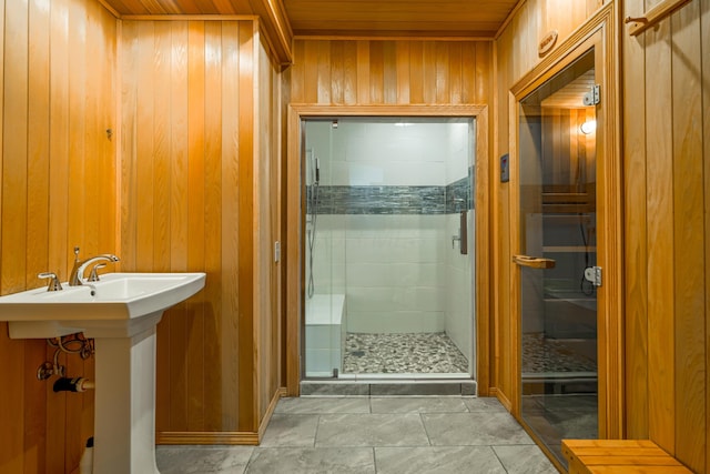 bathroom with wood ceiling, wooden walls, and an enclosed shower