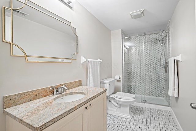 bathroom with vanity, toilet, and walk in shower