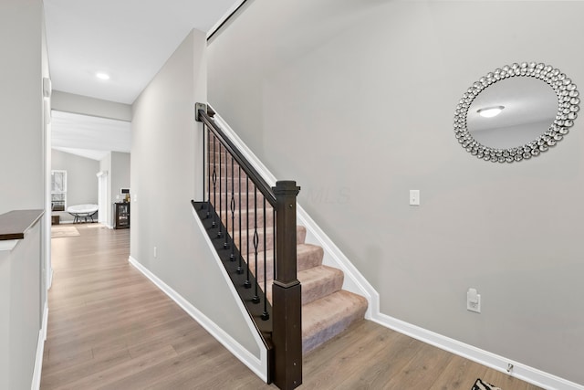 staircase featuring hardwood / wood-style floors