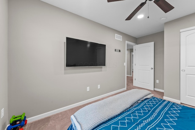 bedroom with ceiling fan and carpet