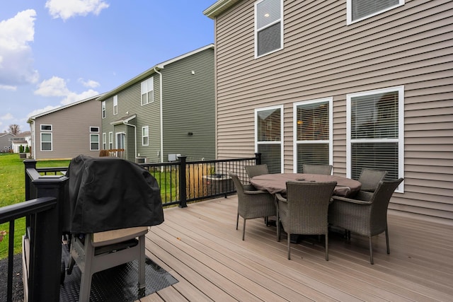 wooden terrace with a grill