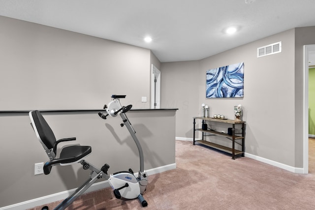 exercise room with light carpet