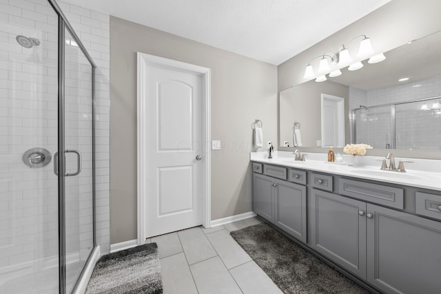 bathroom with vanity, tile patterned floors, and a shower with shower door