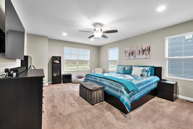 carpeted bedroom featuring ceiling fan