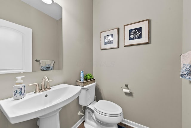 bathroom with toilet and sink