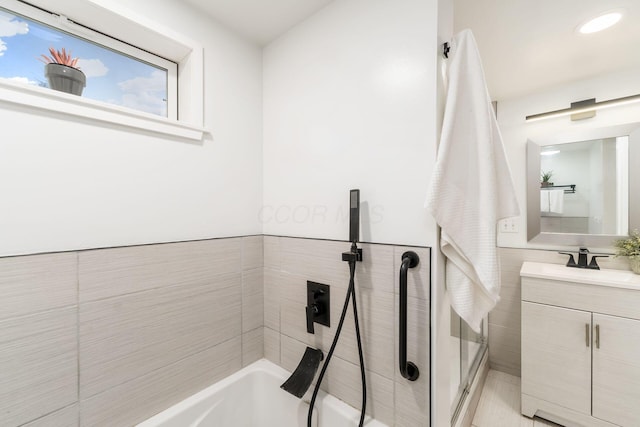 bathroom with vanity and independent shower and bath