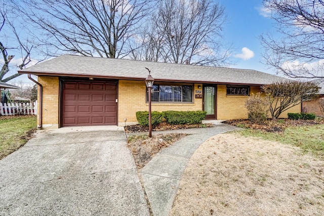 ranch-style house featuring a garage